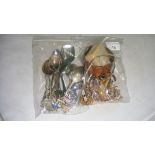 Bag of assorted costume jewellery, earrings and souvenir spoons etc.