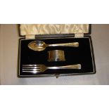 Solid silver christening set including spoon fork and serviette ring in presentation case Birm.