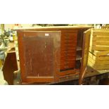 Early 20th century two door cupboard opening to reveal nest of drawers