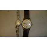 Vintage Gents Smiths wristwatch in gold metal case with leather strap & ladies vintage Regency