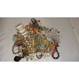 Bag of assorted costume jewellery including necklace beads, necklaces, bangles etc.