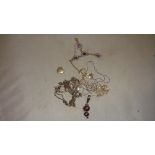 Bag of silver and other necklaces, gold plated and amethyst necklace etc.