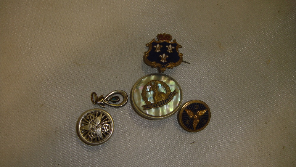 Regimental badges : Norfolk Regiment on mother of pearl back,