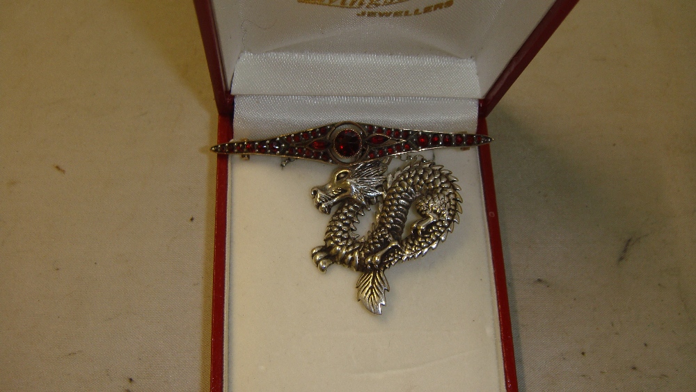 Silver dragon pendant and vintage unmarked gold metal brooch set with garnets