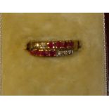 Modern 9 ct gold ring set with a multitude of small rubies and diamonds