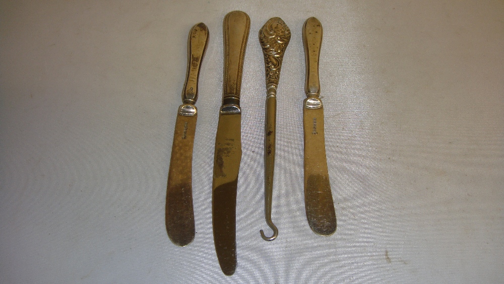 Assorted silver handle knives & button hook