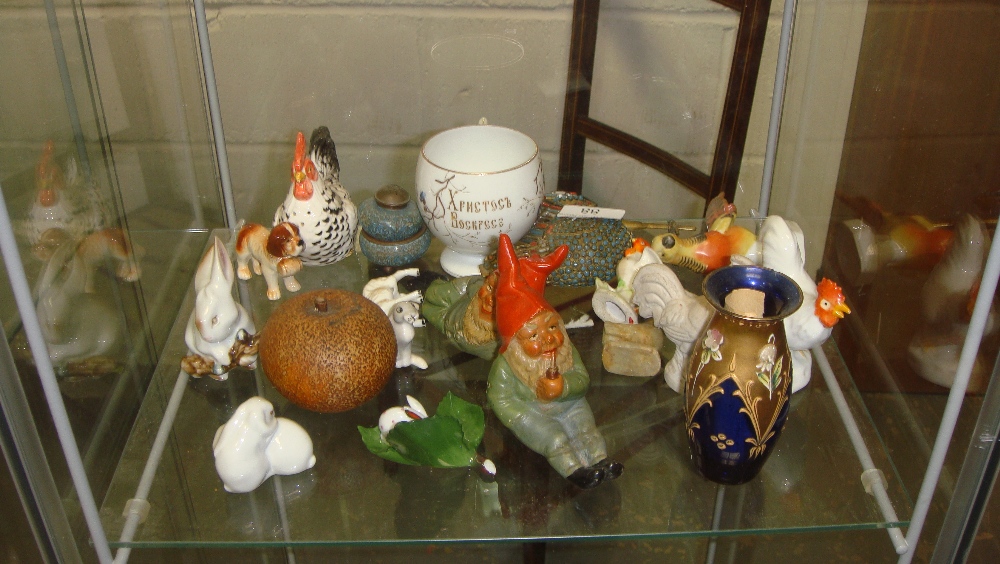 Shelf of decorative china including vintage gnome ornaments