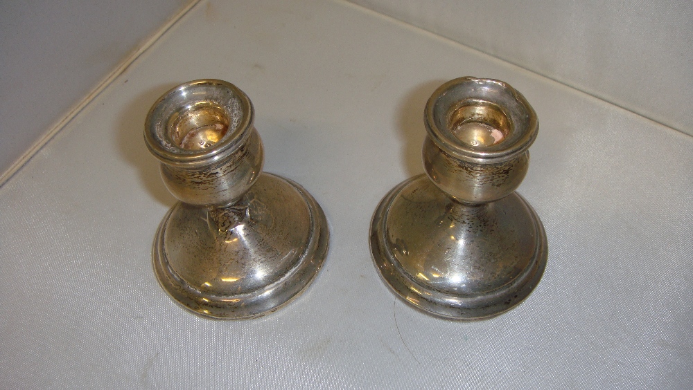 Pair of silver candle sticks marks rubbed