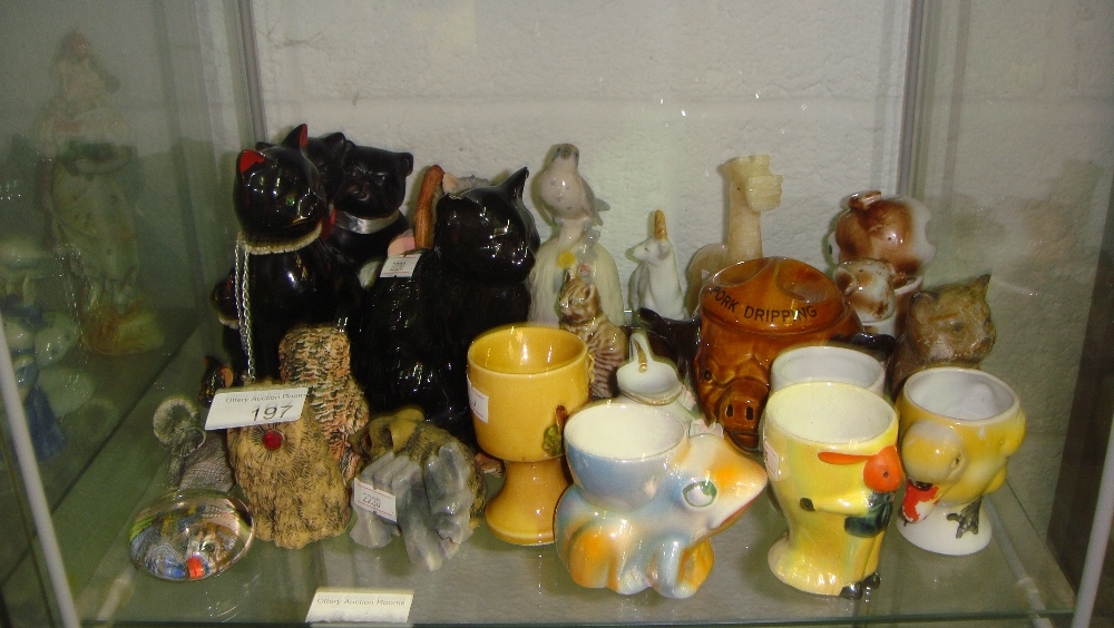 2 x shelves of decorative animal ornaments, egg cups, pickle jars etc.