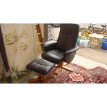 Modern leather easy chair and footstool