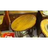 Nest of inlaid oval mahogany tables