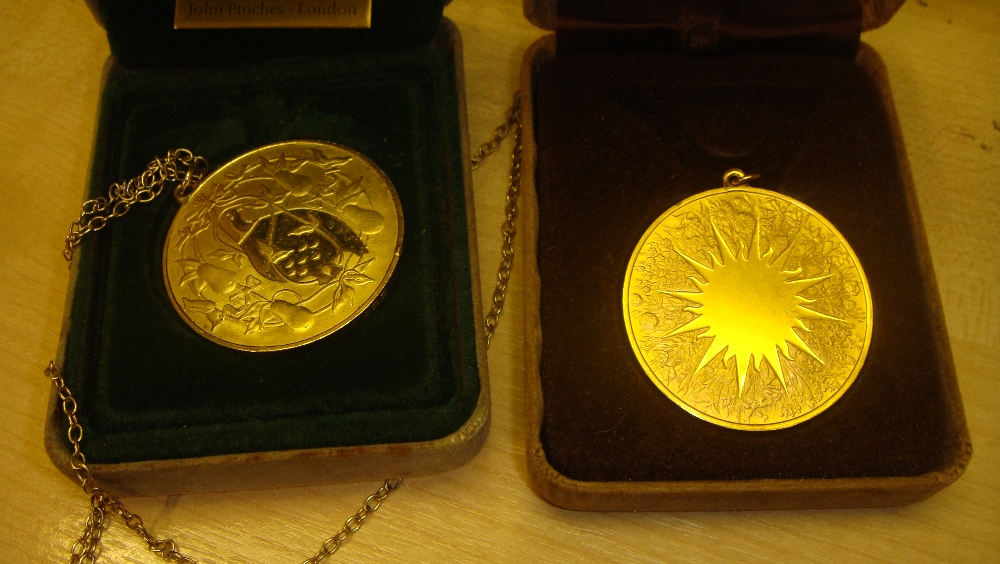 2 x silver gilded medallions,