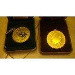 2 x silver gilded medallions,