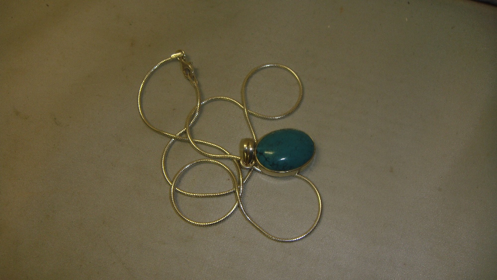 Modern silver and turquoise pendant on chain