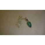 Modern green stone pendant set in silver on chain