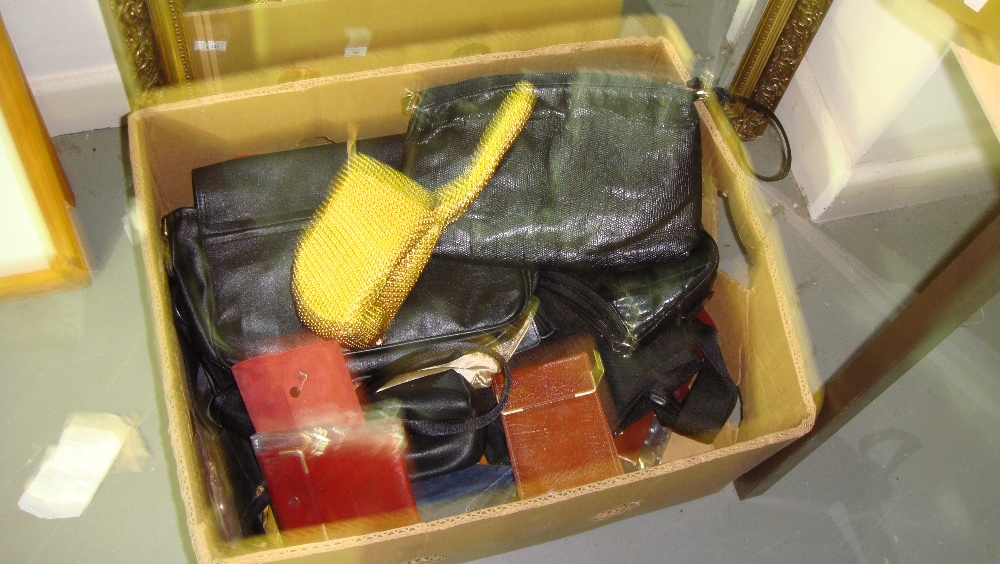 Box of purses and handbags,