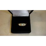 Unmarked but tested 9 ct gold ring set with three opals in presentation box 1 g size 55