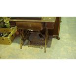 Vintage Singer sewing machine with cast iron base