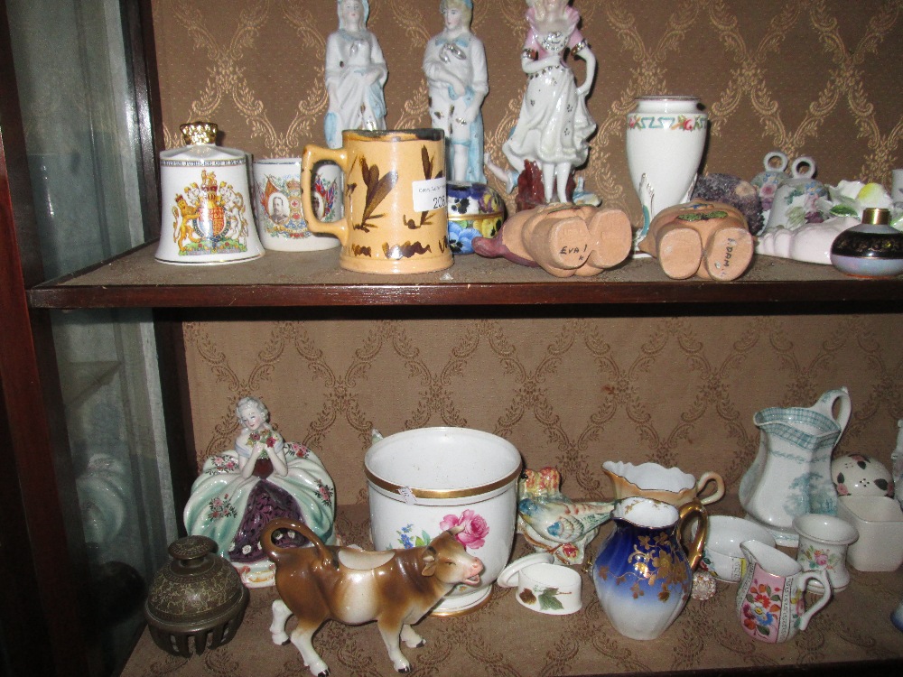 2 x shelves of decorative ornaments : Capo figure, commemorative ware,