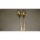 Pair of silver golfing teaspoons Birm.