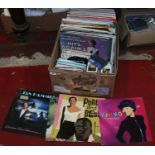 A box of records, singles and tapes to include ValDoonican, John Hanson, Peter Dawson,