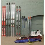 A quantity of ski related items to include 2m Sylvain Saudan , Sisher & Cut 70 skis, boots,