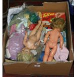 A box of miscellaneous to include dolls and dolls clothing, board games etc.