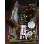 A box of miscellaneous including framed pictures, cranberry glass bell,