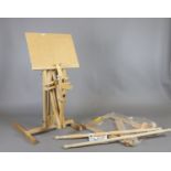 A wooden tapestry frame and adjustable folding easel.