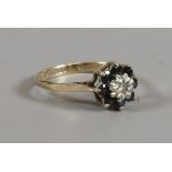 A 9ct gold sapphire and diamond cluster ring, assayed Birmingham 1976, size P.