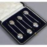 A cased set of six silver coffee bean spoons assayed Sheffield 1917.