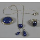 An assembled suite of Lapis Lazuli jewellery, an ovoid brooch, ring and necklet.