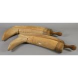 A pair of four piece wooden riding boot trees.