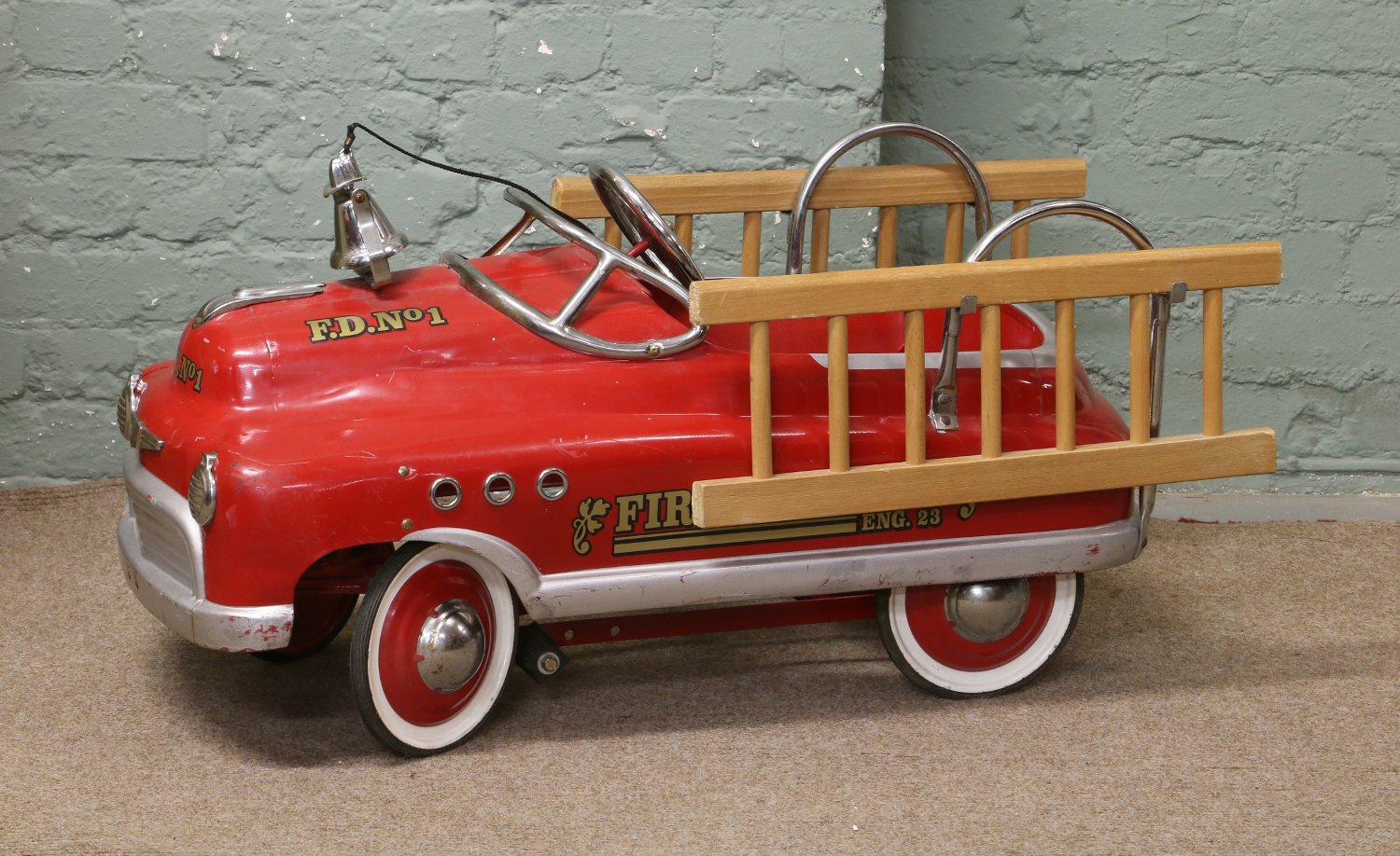 A childs vintage pedal car fire engine.