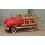 A childs vintage pedal car fire engine.