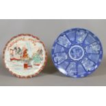 A Japanese fluted Kutani dish and another dish printed in underglaze blue.