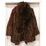 A ladies fur three quarter length coat and two fur stoles.