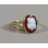 A Victorian 9ct gold hardstone cameo ring with profile portrait of a gladiator on split shoulders,