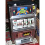 A novelty Casino Crown one arm bandit slot machine/money box.