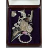 A box of silver jewellery including Indian niello pendant, St Christopher and paste set examples.