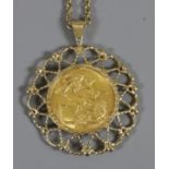A George V sovereign 1918 in open work 9ct gold mount on chain 18.34 grams.