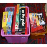 Two boxes of assorted childrens games Connect Four, Monopoly,