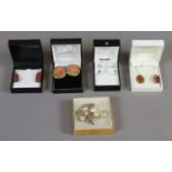 A collection of boxed silver jewellery including a pair of amber earrings and carved bone earrings