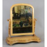 A Victorian walnut toilet mirror.