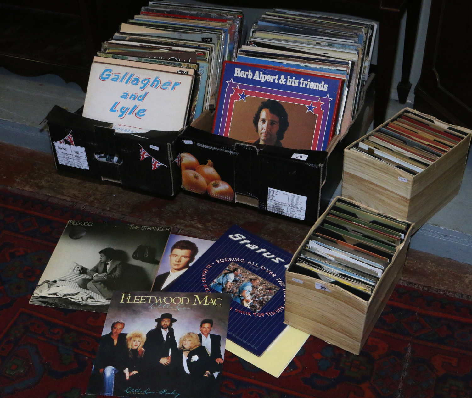 Four boxes of L.P and single records to include rock, pop and easy listening.