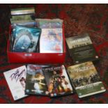 A box of DVDs to include sealed box sets of crime, action and fantasy interest.