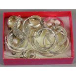 A collection of silver earrings,