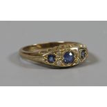 A 9ct gold sapphire and diamond 7 stone boat set ring, size P.