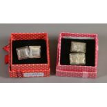 Two pairs of vintage silver cufflinks.