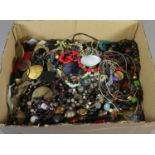 A box containing a large collection of costume jewellery.